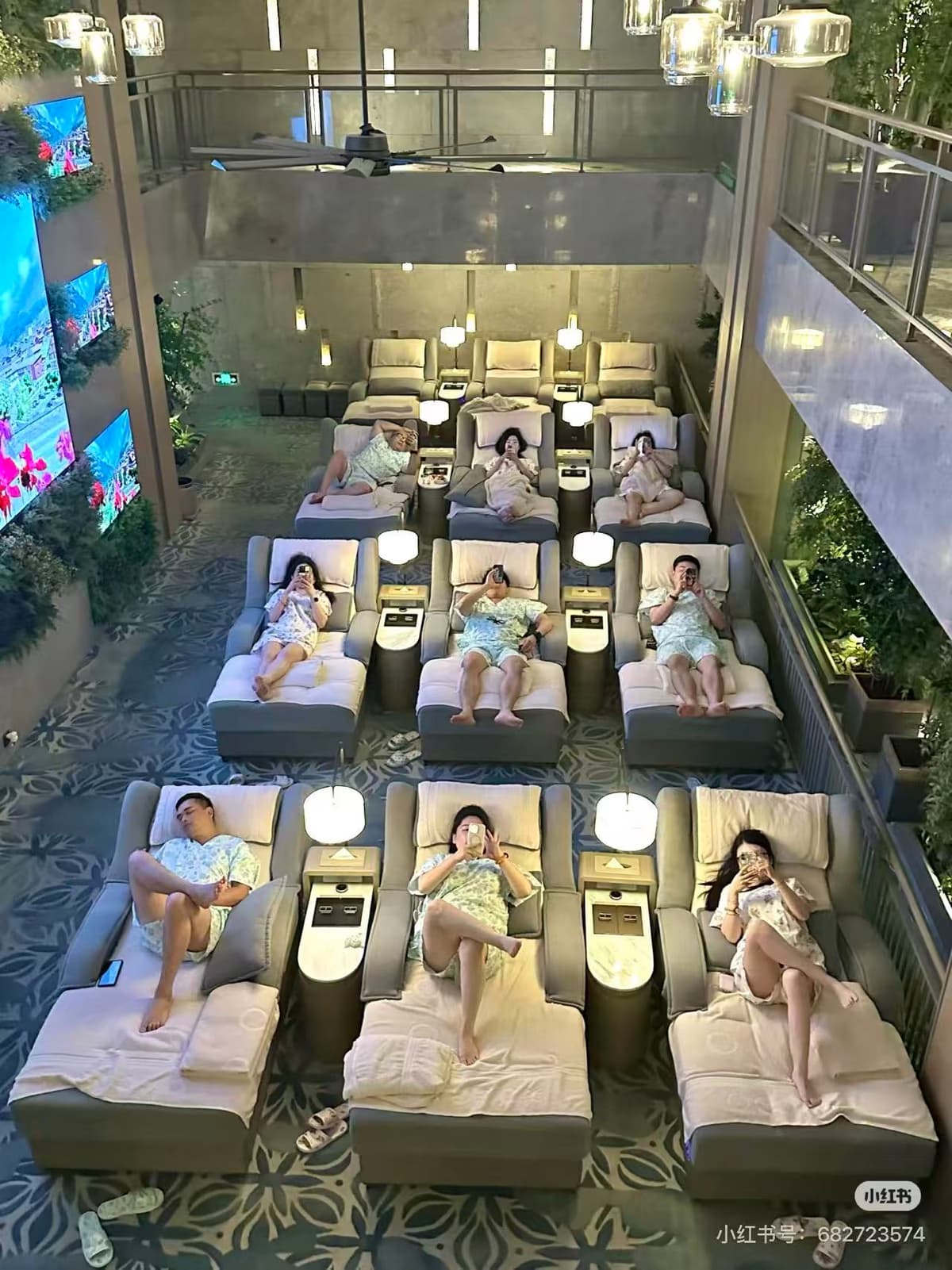 Indoor lounge and dining area at a large Chinese tangquan bath complex with recliners