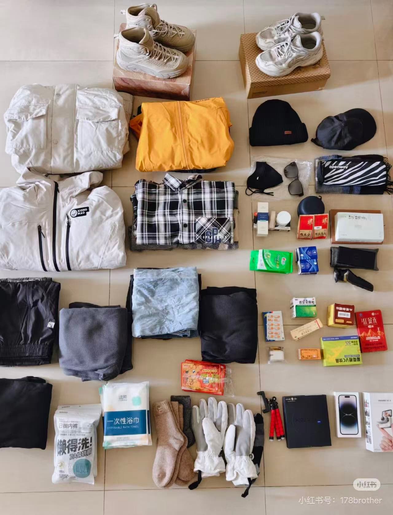 Travel essentials: clothes, shoes, electronics, toiletries, and snacks neatly laid out for a trip - ChinaTripTop.